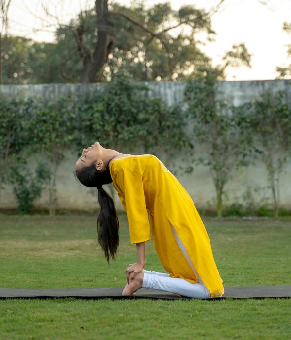 Woman in a calm, focused pose, feeling balanced and energetic.
